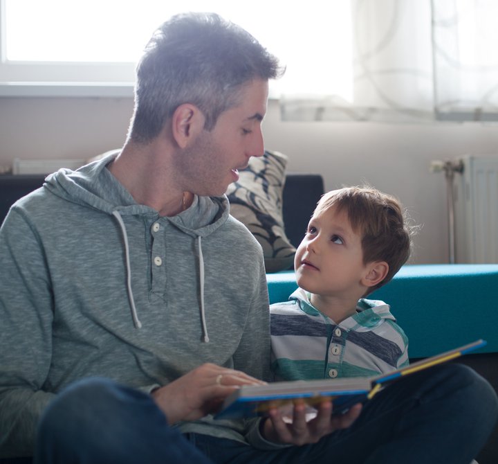 Dad and son sharing a book.jpg