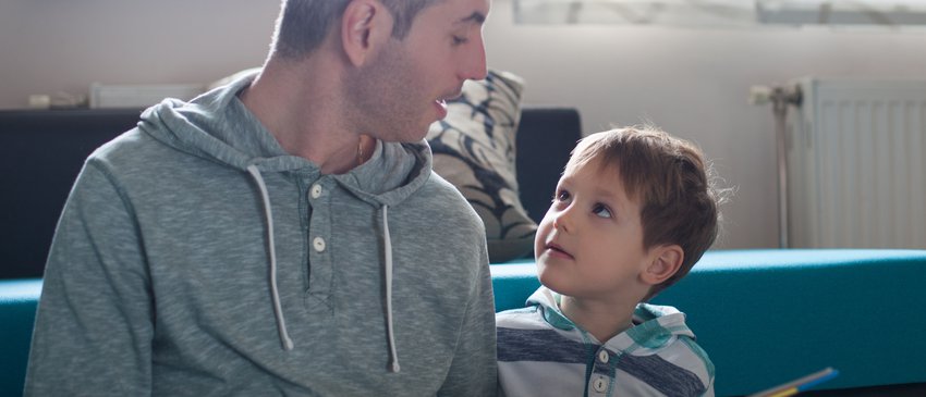 Dad and son sharing a book.jpg
