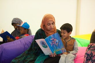 Mother reading to early years child.jpg