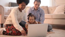 parents and child at laptop.jpg